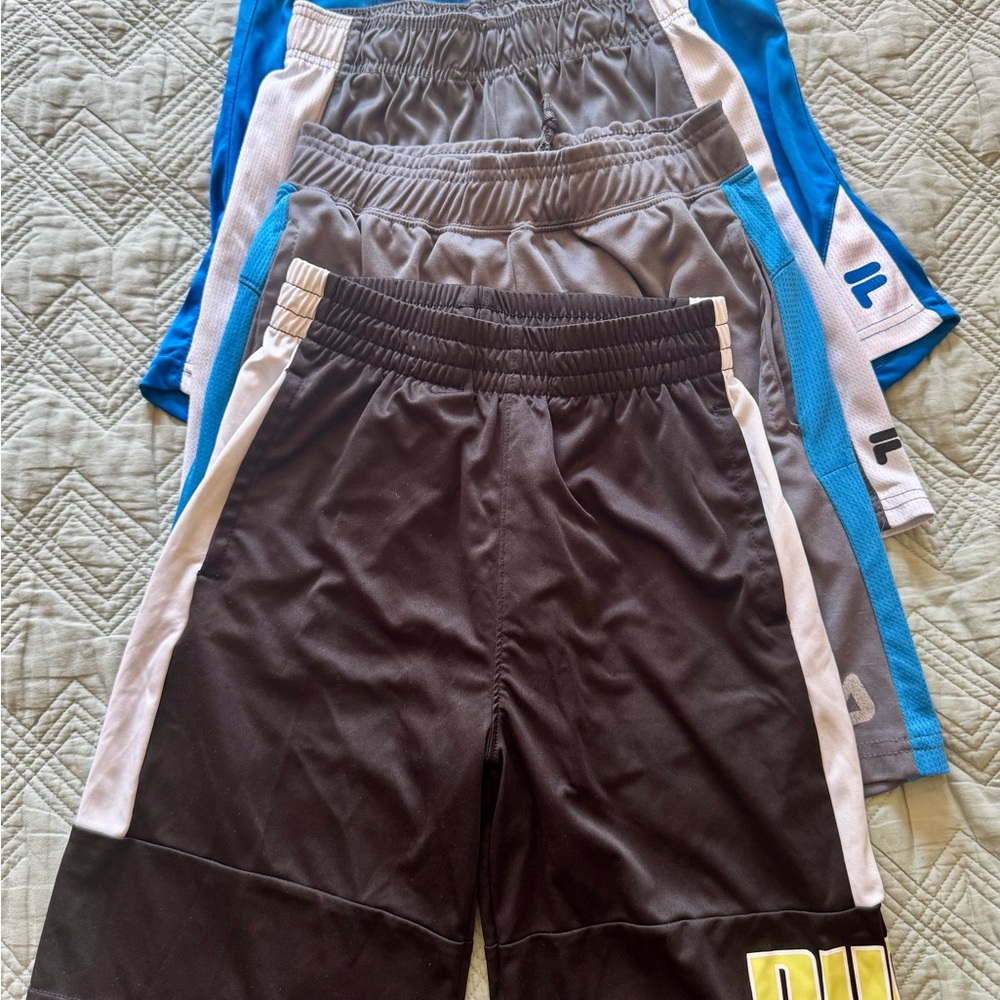 4 pairs boys shorts, size 10-12. Braids Fila and Puma.  Elastic Waisband